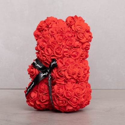 Oso de rosa roja